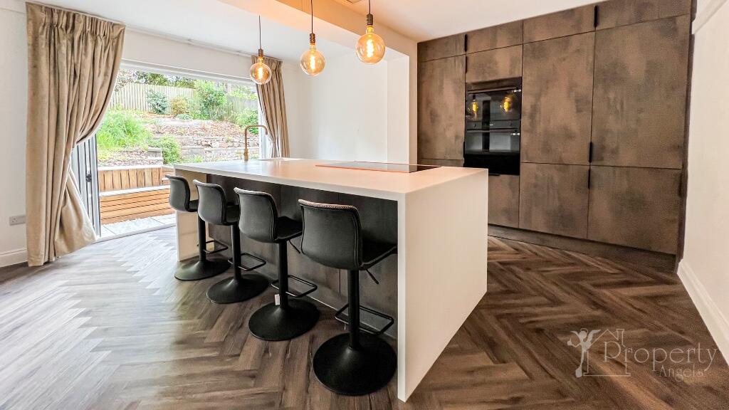 Modern kitchen with island and bar stools
